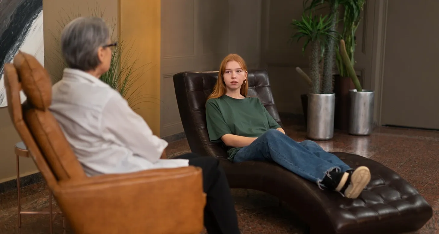 A therapist supporting a patient during walking practice