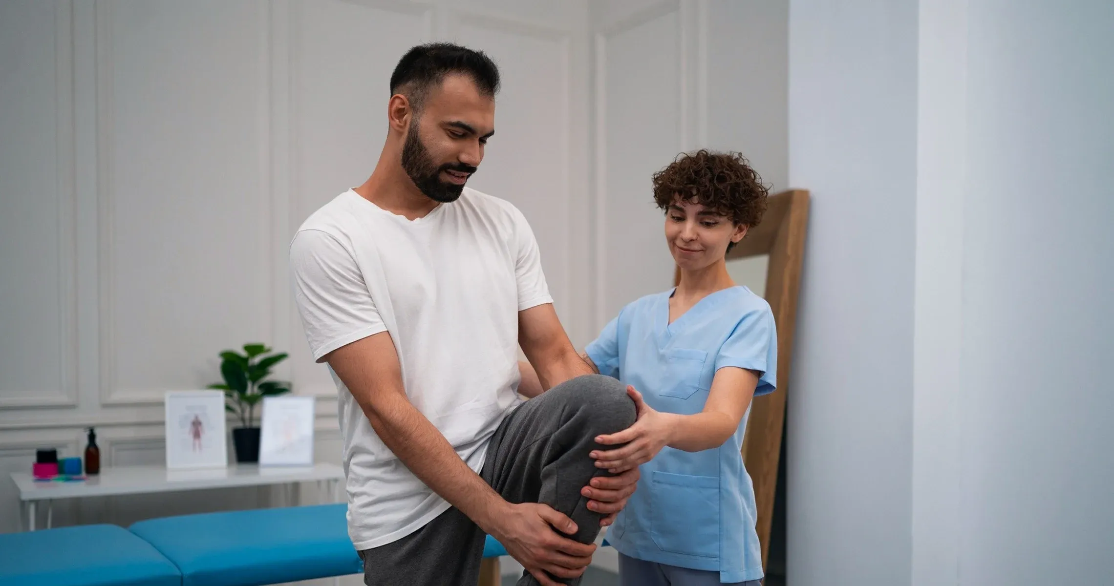 An occupational therapist working with a patient at a table