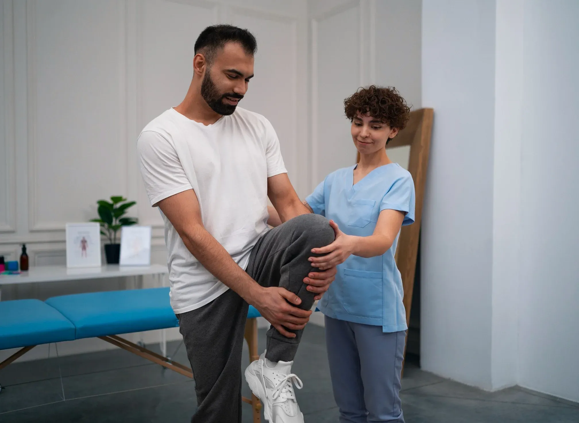 An occupational therapist working with a patient at a table